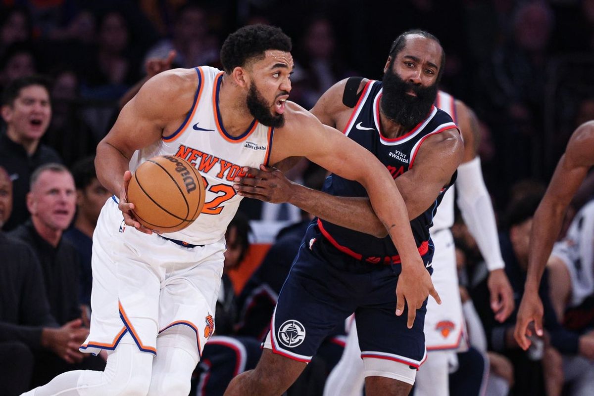 Jan 7, 2026; New York, New York, USA; New York Knicks center Karl-Anthony Towns (32) dribbles as LA Clippers guard James Harden (1) defends during the first half at Madison Square Garden. Mandatory Credit: Vincent Carchietta-Imagn Images