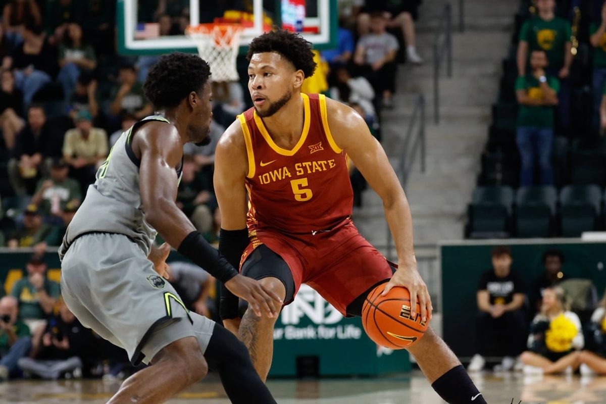 Jan 7, 2026; Waco, Texas, USA;  Iowa State Cyclones forward Joshua Jefferson (5) controls the ball as Baylor Bears guard Tounde Yessoufou (24) defends during the first half at Paul and Alejandra Foster Pavilion. Mandatory Credit: Chris Jones-Imagn Images