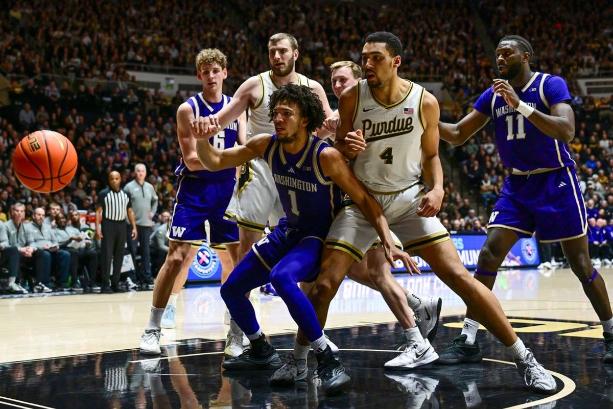 Jan 7, 2026; West Lafayette, Indiana, USA; Washington Huskies guard Desmond Claude (1) and Purdue Boilermakers forward Trey Kaufman-Renn (4) watch a ball go out of bounds during the first half at Mackey Arena. Mandatory Credit: Marc Lebryk-Imagn Images