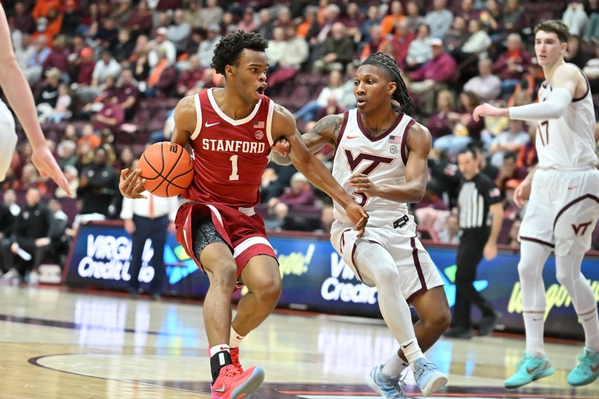 Jan 7, 2026; Blacksburg, Virginia, USA;  Stanford Cardinal guard Ebuka Okorie (1) drives with the ball as Virginia Tech Hokies guard Ben Hammond (3) defends during the second half at Cassell Coliseum. Mandatory Credit: Brian Bishop-Imagn Images