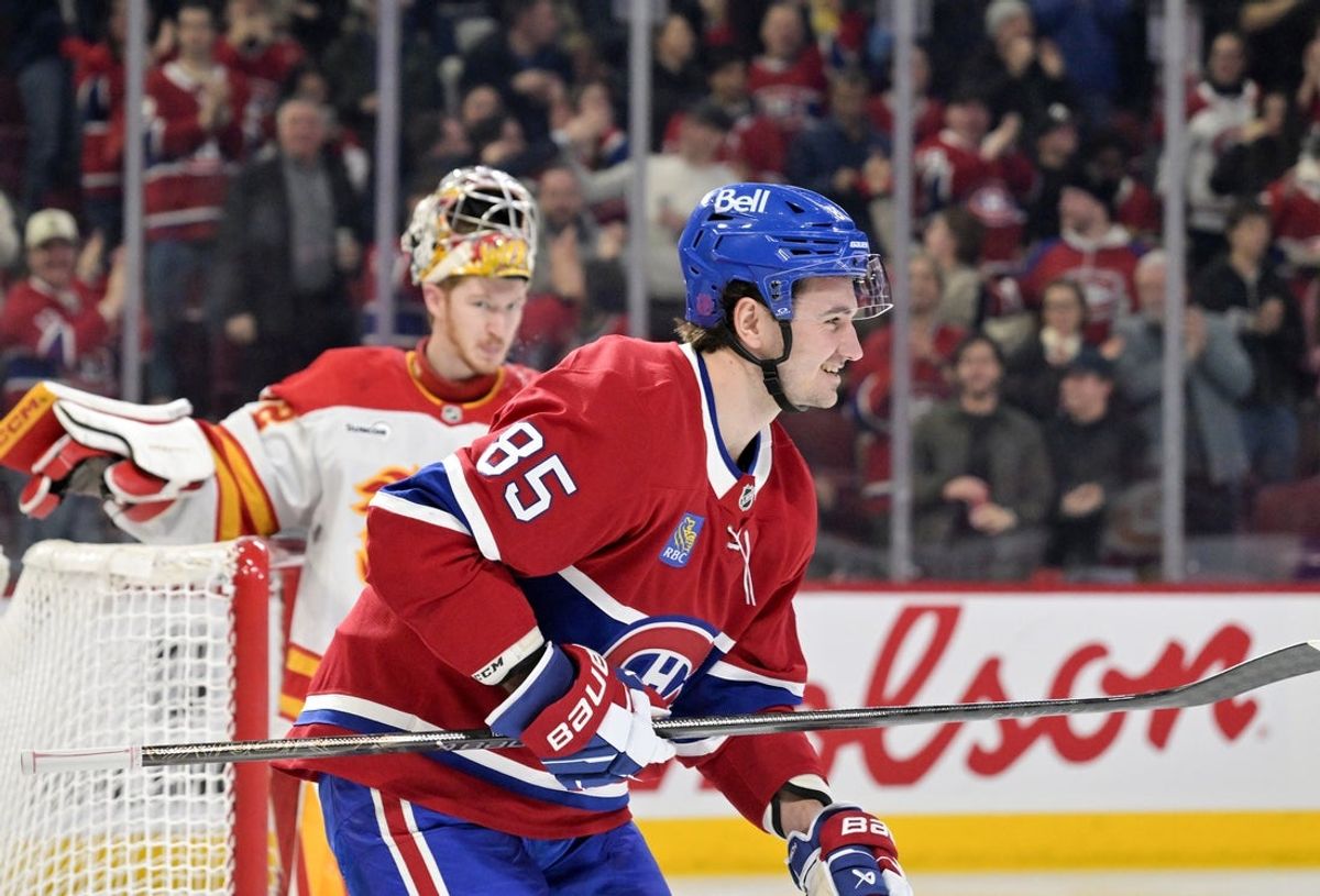 Jan 7, 2026; Montreal, Quebec, CAN; Montreal Canadiens forward Alexandre Texier (85) celebrates after scoring a goal against Calgary Flames goalie Dustin Wolf (32) during the second period at the Bell Centre. Mandatory Credit: Eric Bolte-Imagn Images