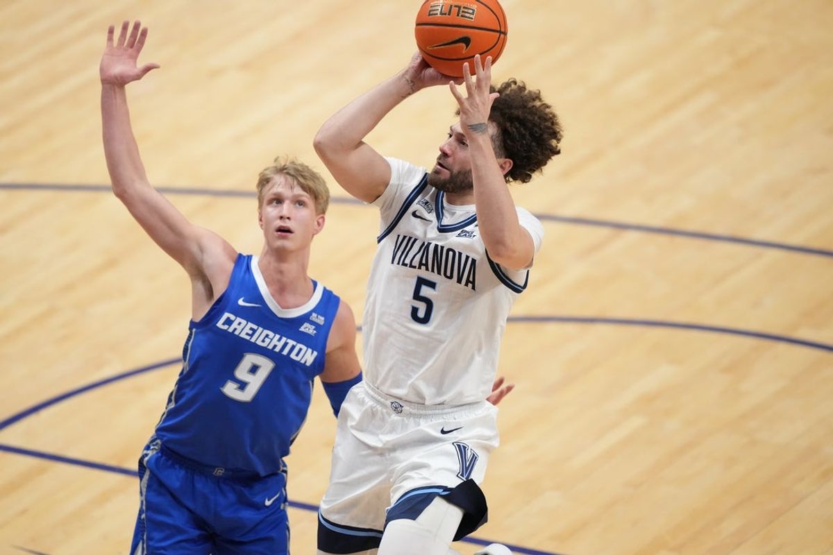 Jan 7, 2026; Villanova, Pennsylvania, USA; Villanova Wildcats guard Devin Askew (5) shoots the ball against Creighton Bluejays guard Ty Davis (9) in the second half at William B. Finneran Pavilion. Mandatory Credit: Kyle Ross-Imagn Images