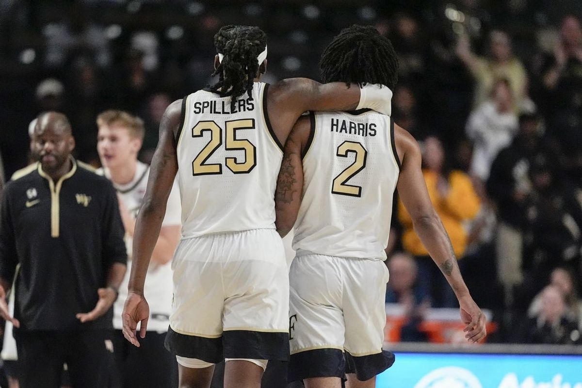 Jan 7, 2026; Winston-Salem, North Carolina, USA; Wake Forest Demon Deacons forward Tre'von Spillers (25) hugs forward Juke Harris (2) after a late thee point shot to tie the game against the Miami (FL) Hurricanes during the second half at Lawrence Joel Veterans Memorial Coliseum. Mandatory Credit: Jim Dedmon-Imagn Images