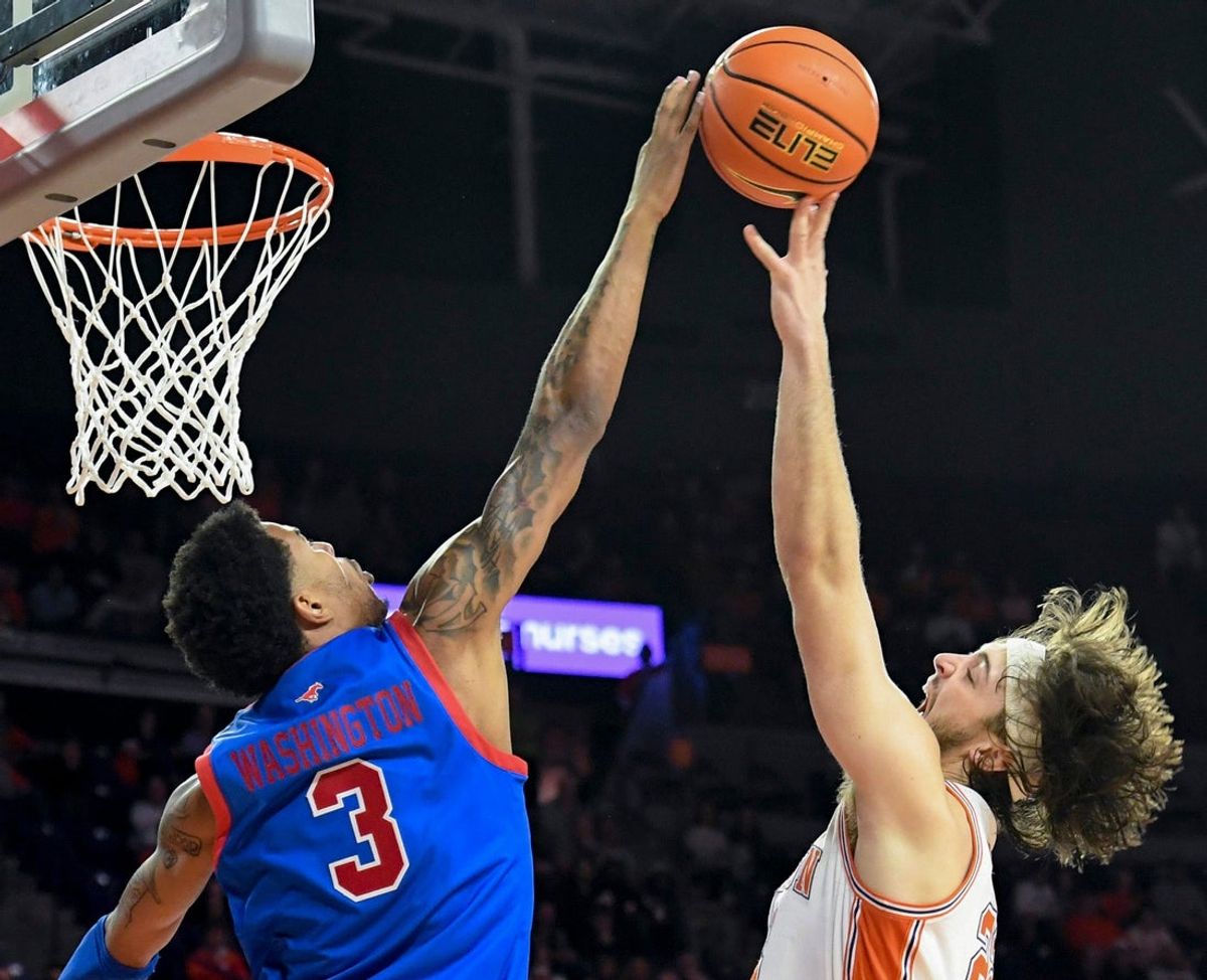 SMU Mustangs forward Corey Washington (3) defends the shot of Clemson Tigers center Carter Welling (22) Wednesday, Jan. 7, 2026, during the NCAA men’s basketball game at Littlejohn Coliseum in Clemson, South Carolina.