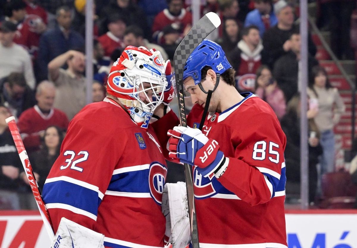Jan 7, 2026; Montreal, Quebec, CAN; Montreal Canadiens goalie Jacob Fowler (32) celebrates the win against the Calgary Flames with teammate forward Alexandre Texier (85) at the Bell Centre. Mandatory Credit: Eric Bolte-Imagn Images