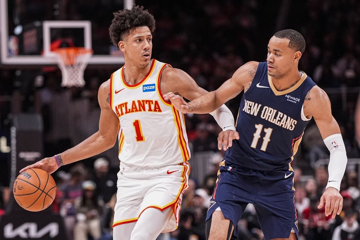 Jan 7, 2026; Atlanta, Georgia, USA; Atlanta Hawks forward Jalen Johnson (1) dribbles defended by New Orleans Pelicans guard Bryce McGowens (11) during the second half at State Farm Arena. Mandatory Credit: Dale Zanine-Imagn Images