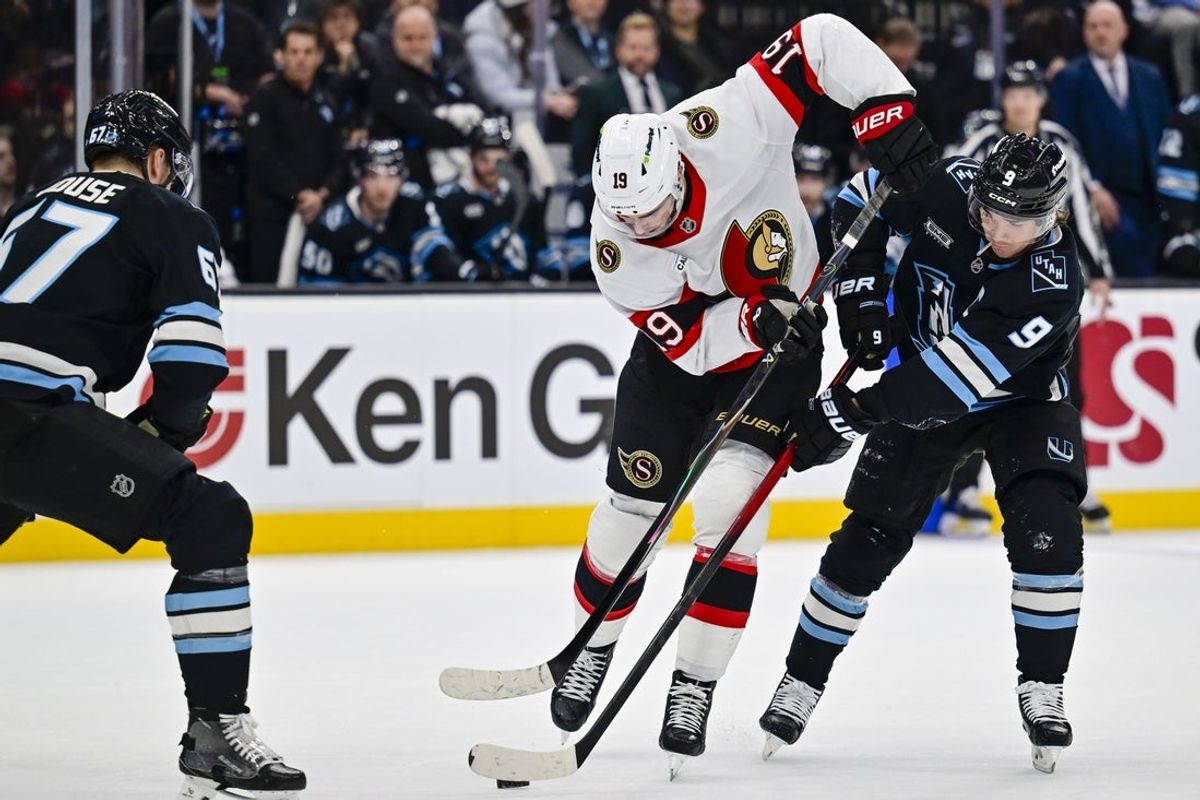 Jan 7, 2026; Salt Lake City, Utah, USA; Ottawa Senators right wing Drake Batherson (19) controls the puck from Utah Mammoth right wing Clayton Keller (9) during first period at Delta Center. Mandatory Credit: Peter Creveling-Imagn Images