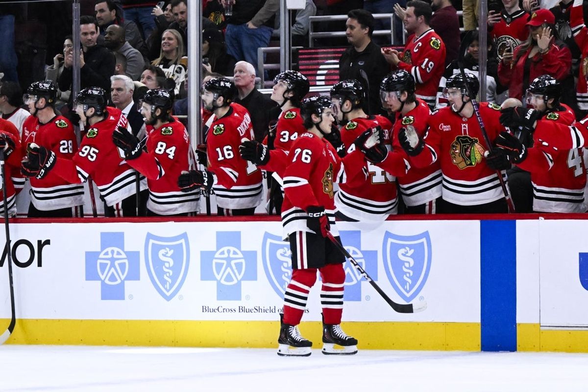 Jan 7, 2026; Chicago, Illinois, USA; Chicago Blackhawks left wing Nick Lardis (76) celebrates with teammates after scoring a goal against the St. Louis Blues during the first period at the United Center. Mandatory Credit: Matt Marton-Imagn Images