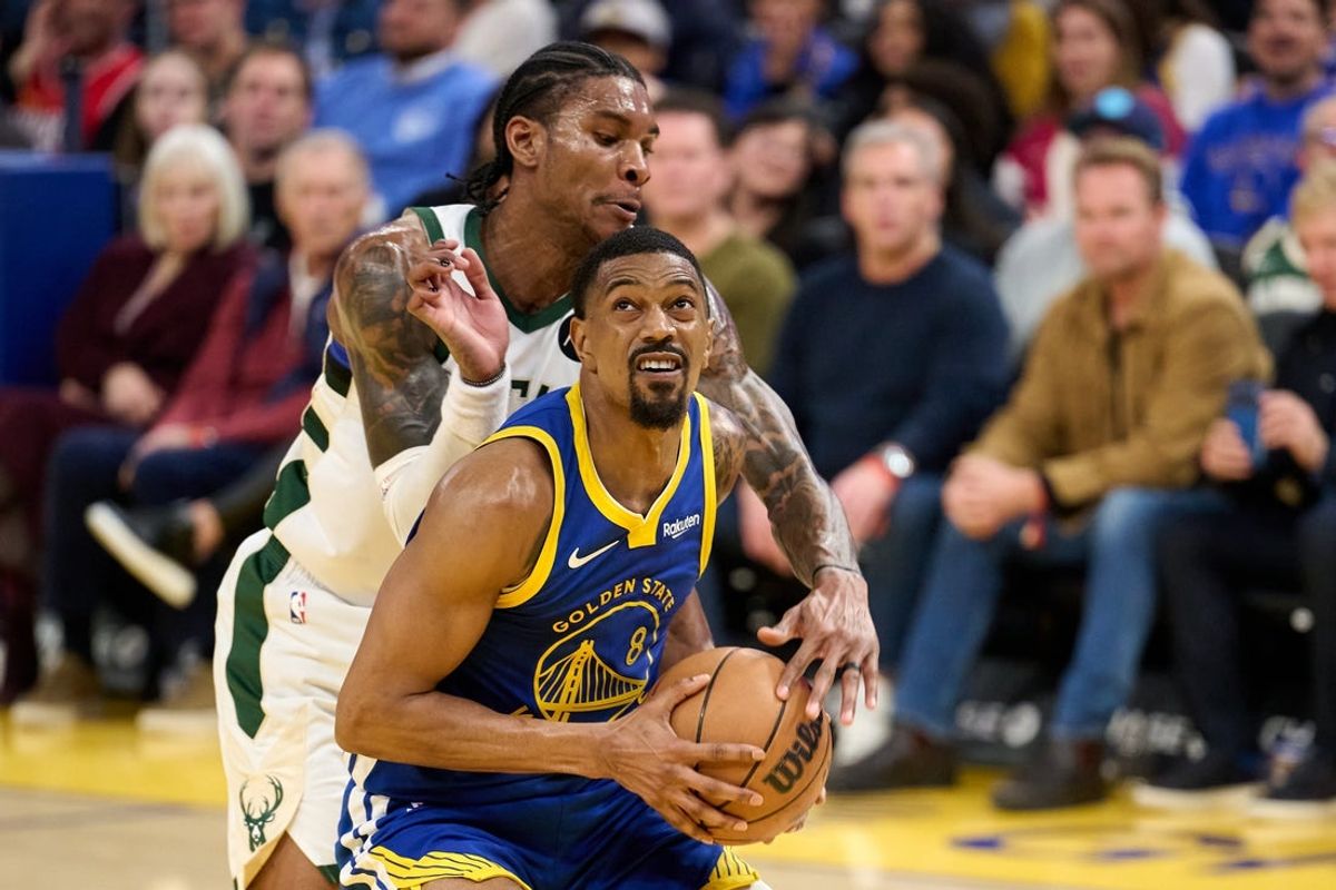 Jan 7, 2026; San Francisco, California, USA; Golden State Warriors guard De'Anthony Melton (8) drives to the basket against Milwaukee Bucks guard Kevin Porter Jr. (7) during the fourth quarter at Chase Center. Mandatory Credit: Robert Edwards-Imagn Images