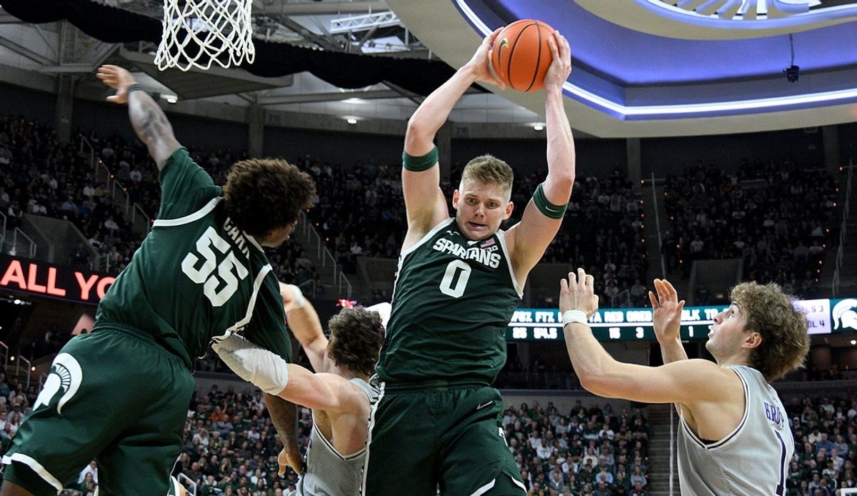 Jan 8, 2026; East Lansing, Michigan, USA;  Michigan State Spartans forward Jaxon Kohler (0) makes a rebound against the Northwestern Wildcats during the first half at Jack Breslin Student Events Center. Mandatory Credit: Dale Young-Imagn Images