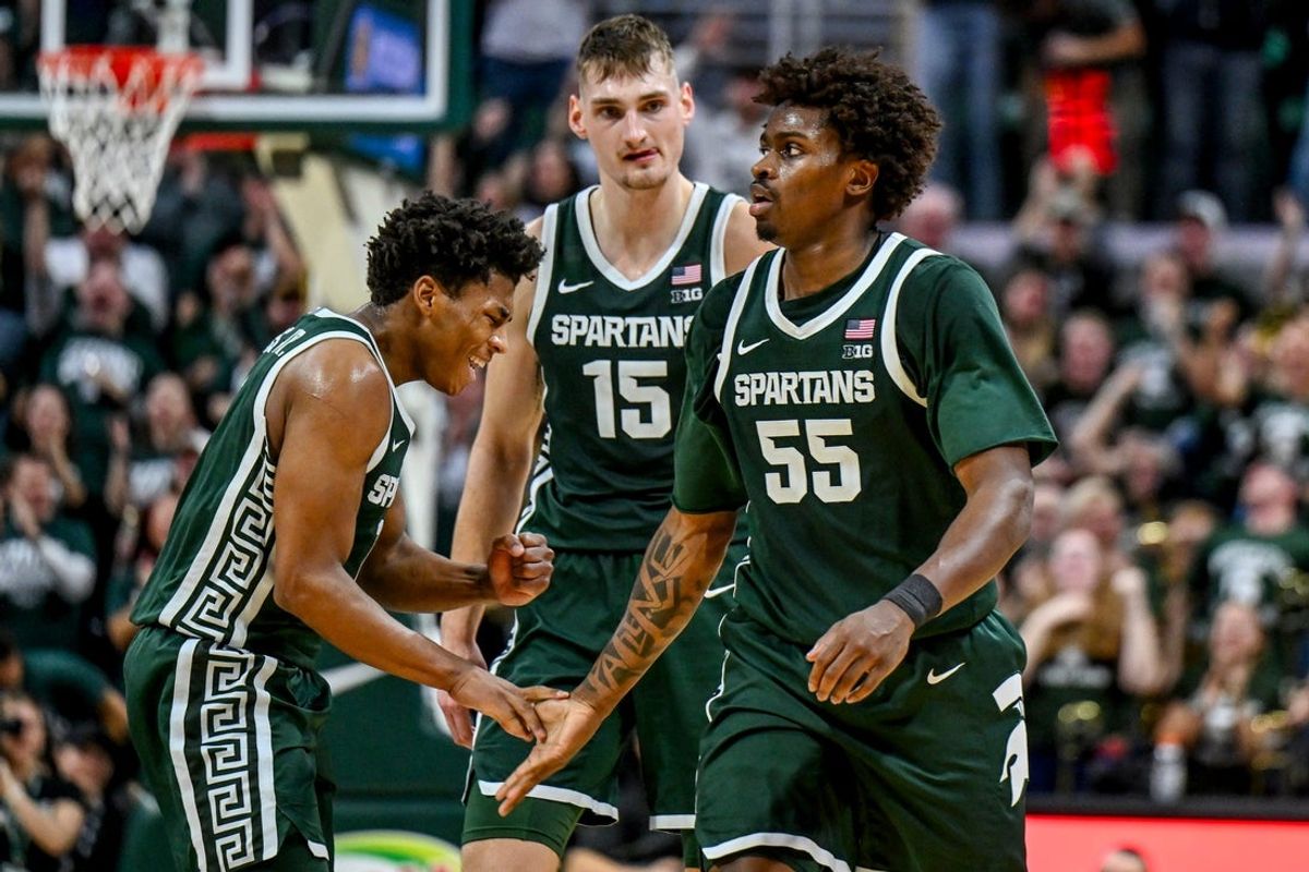 Michigan State's Jeremy Fears Jr., left, slaps hands with Coen Carr, right, after Carr's dunk against Northwestern during the second half on Thursday, Jan. 8, 2026, at the Breslin Center in East Lansing.
