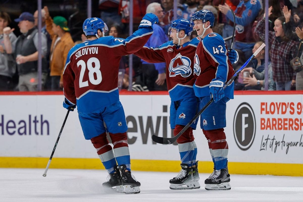 Jan 8, 2026; Denver, Colorado, USA; Colorado Avalanche defenseman Josh Manson (42) celebrates his goal with center Ross Colton (20) and defenseman Ilya Solovyov (28) in the first period against the Ottawa Senators at Ball Arena. Mandatory Credit: Isaiah J. Downing-Imagn Images