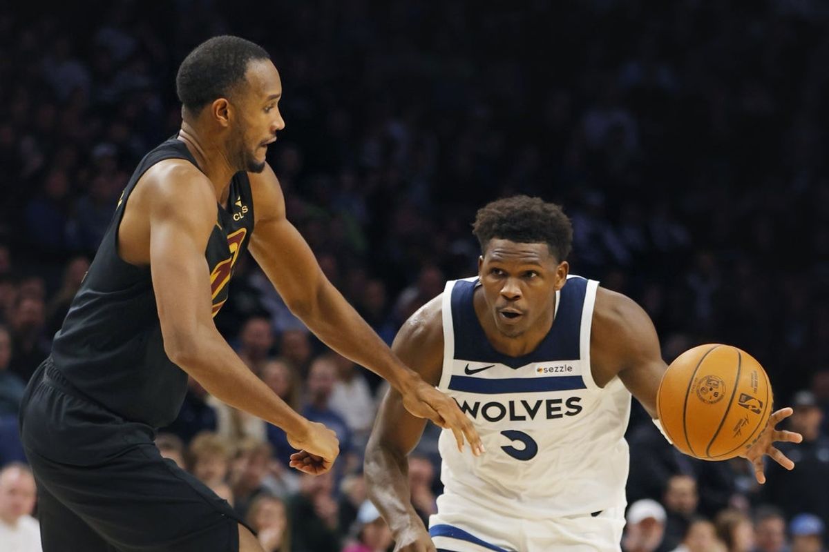 Jan 8, 2026; Minneapolis, Minnesota, USA; Cleveland Cavaliers forward Evan Mobley (4) defends against Minnesota Timberwolves guard Anthony Edwards (5) in the fourth quarter at Target Center. Mandatory Credit: Bruce Kluckhohn-Imagn Images