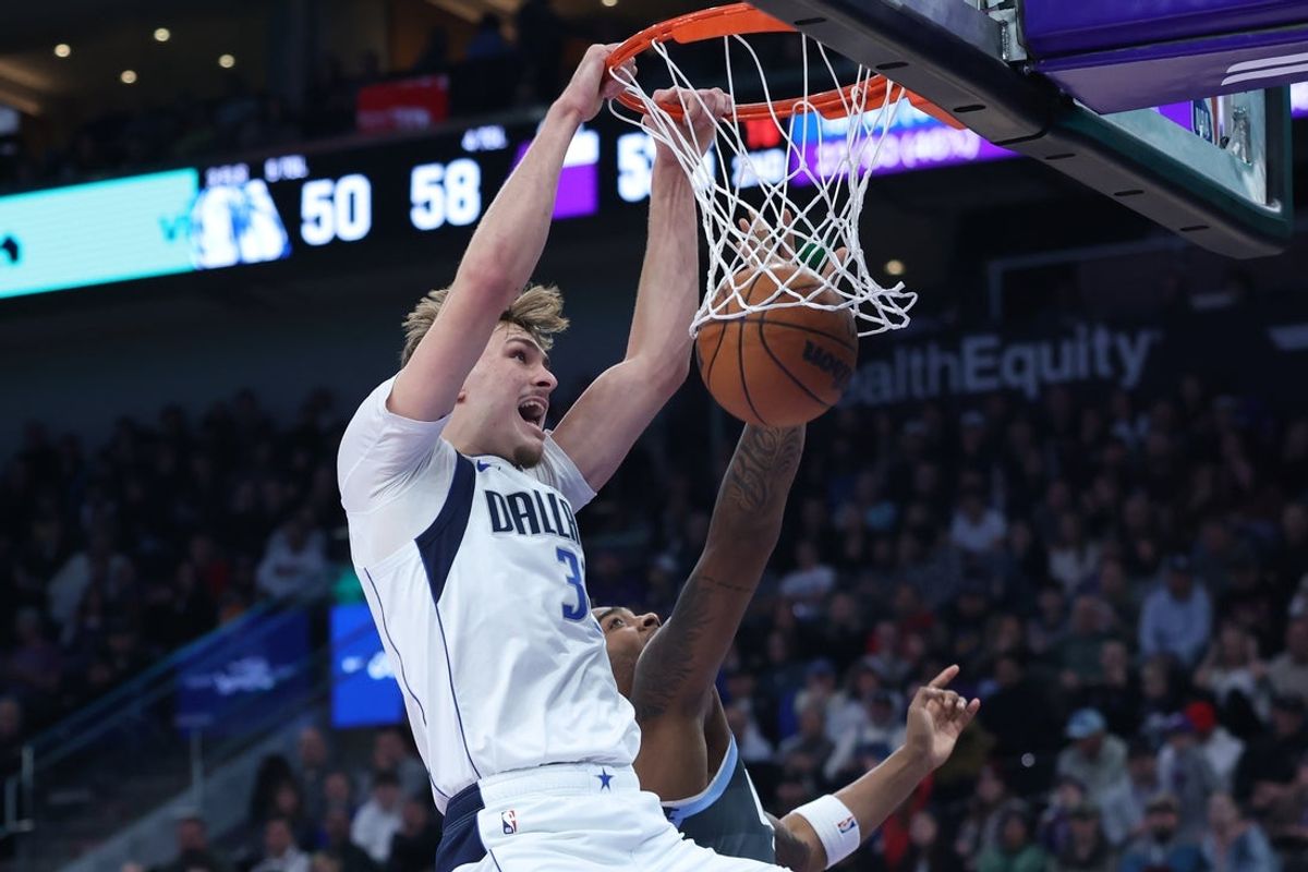 Jan 8, 2026; Salt Lake City, Utah, USA; Dallas Mavericks forward Cooper Flagg (32) dunks the ball against the Utah during the first half at Delta Center. Mandatory Credit: Rob Gray-Imagn Images