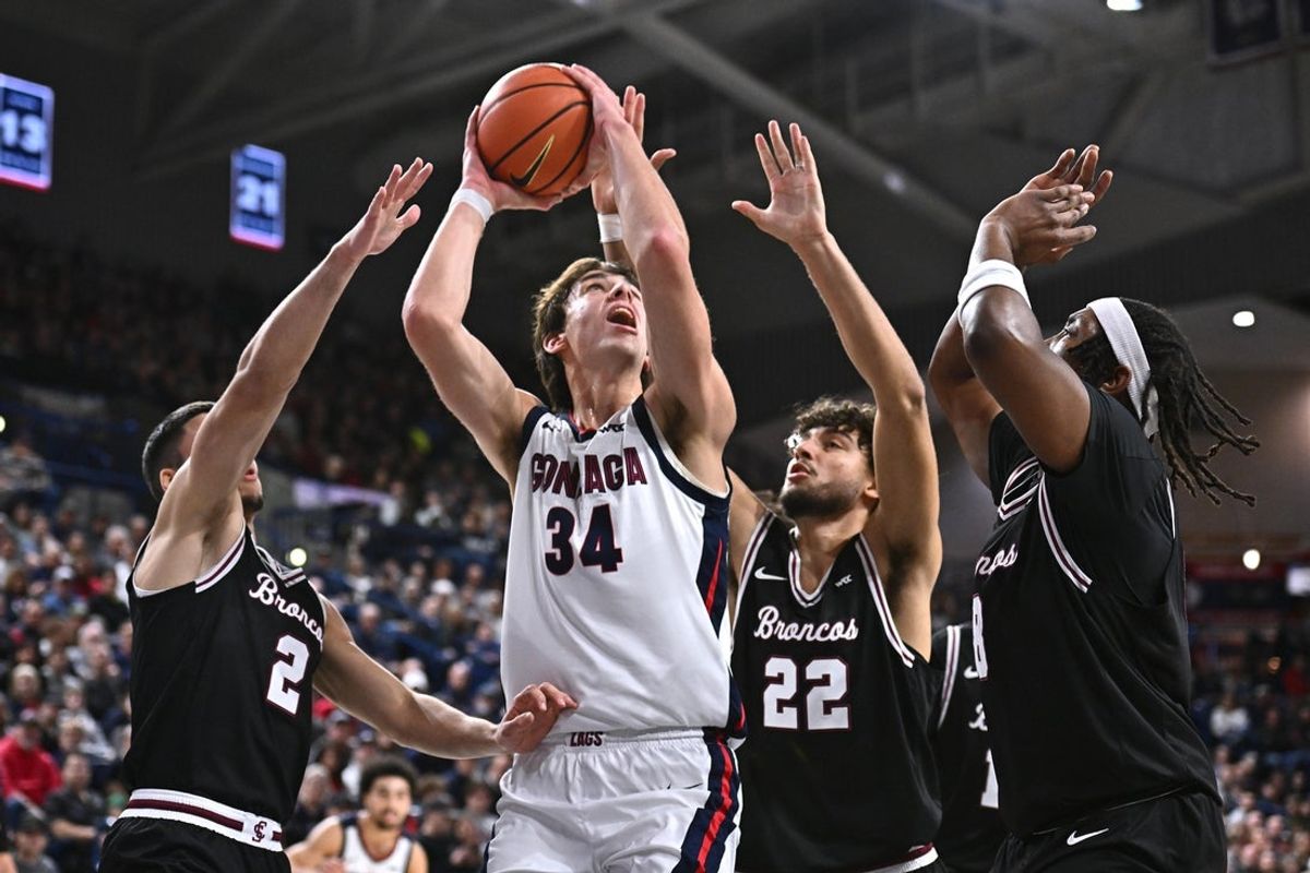 Jan 8, 2026; Spokane, Washington, USA; Gonzaga Bulldogs forward Braden Huff (34) shoots the ball against Santa Clara Broncos guard Sash Gavalyugov (2) and Santa Clara Broncos forward Allen Graves (22) in the first half at McCarthey Athletic Center. Mandatory Credit: James Snook-Imagn Images