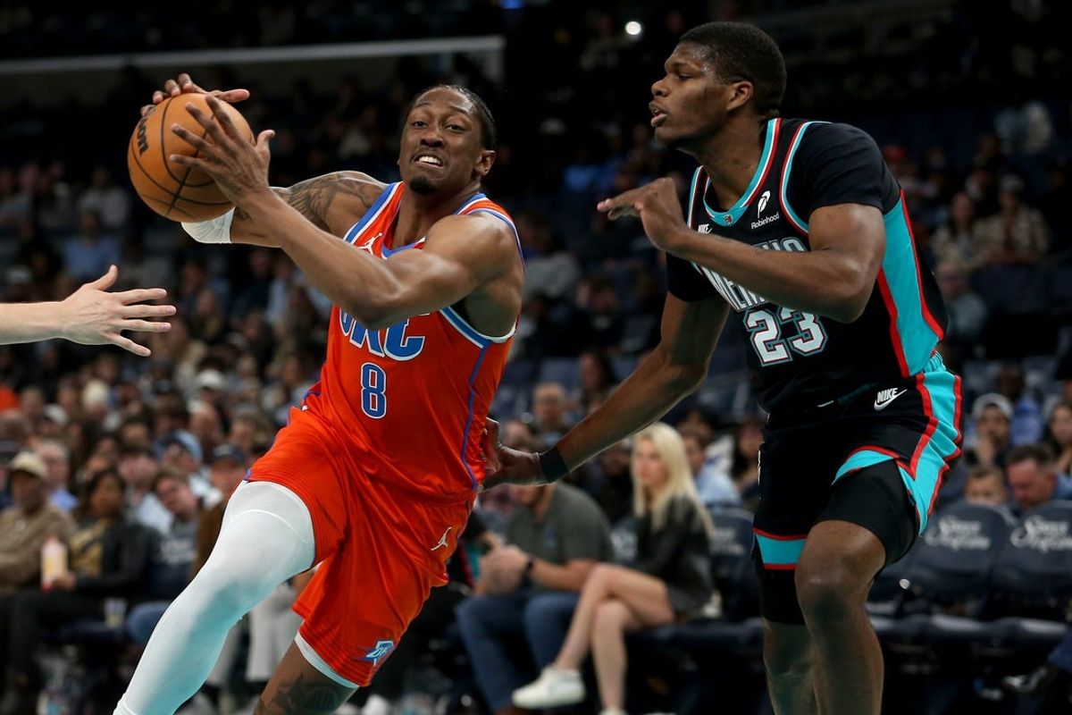 Jan 9, 2026; Memphis, Tennessee, USA; Oklahoma City Thunder guard Jalen Williams (8) drives to the basket as Memphis Grizzlies forward Cedric Coward (23) defends during the first quarter at FedExForum. Mandatory Credit: Petre Thomas-Imagn Images