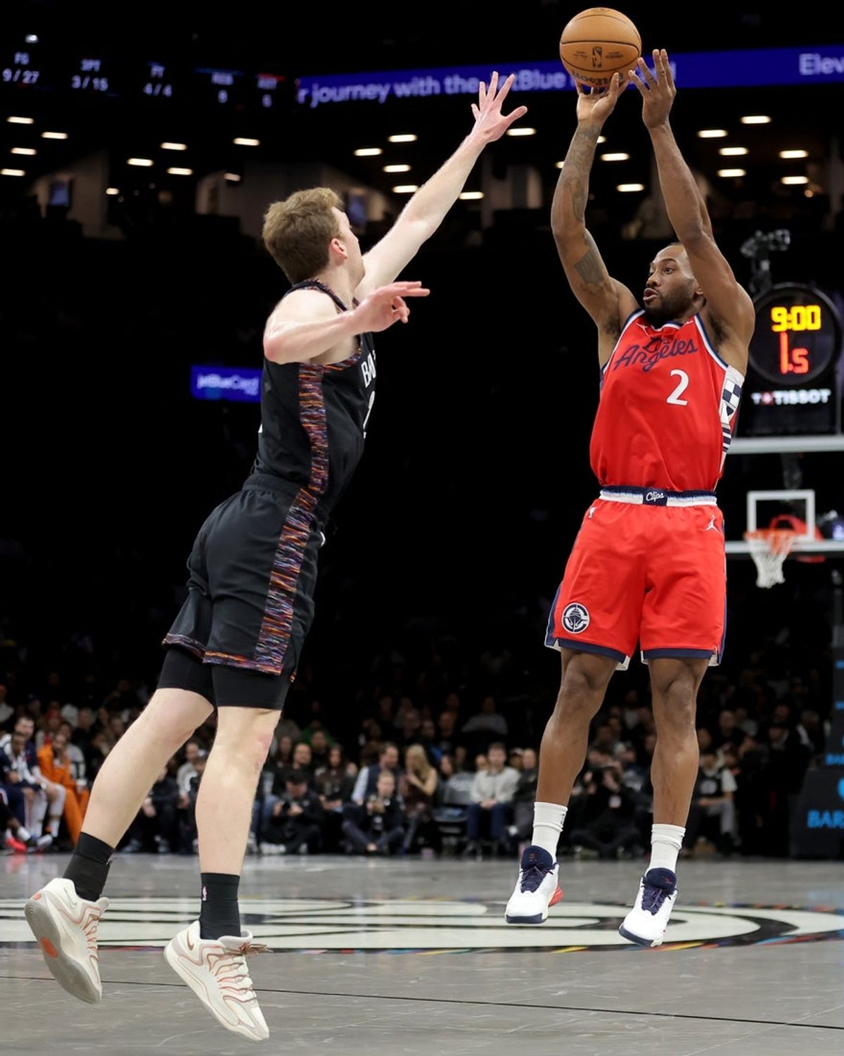 Jan 9, 2026; Brooklyn, New York, USA; Los Angeles Clippers forward Kawhi Leonard (2) shoots a three point shot against Brooklyn Nets forward Danny Wolf (2) during the second quarter at Barclays Center. Mandatory Credit: Brad Penner-Imagn Images