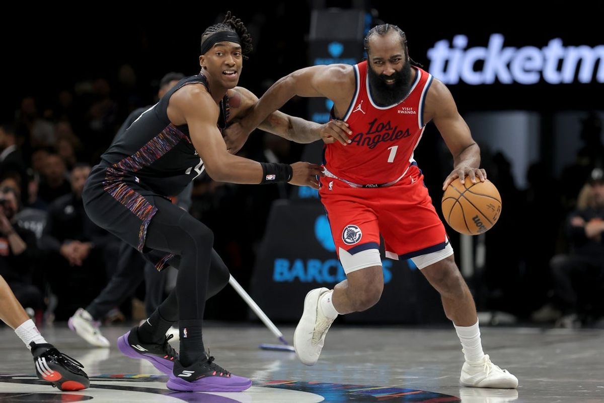 Jan 9, 2026; Brooklyn, New York, USA; Los Angeles Clippers guard James Harden (1) controls the ball against Brooklyn Nets guard Terance Mann (14) during the second quarter at Barclays Center. Mandatory Credit: Brad Penner-Imagn Images