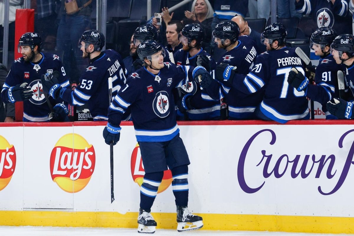 Jan 9, 2026; Winnipeg, Manitoba, CAN;  Winnipeg Jets forward Vladislav Namestnikov (7) is congratulated by his team mates on his goal against the Los Angeles Kings during the first period at Canada Life Centre. Mandatory Credit: Terrence Lee-Imagn Images