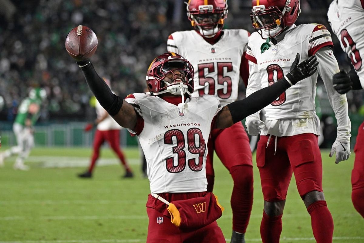 Jan 4, 2026; Philadelphia, Pennsylvania, USA;  Washington Commanders safety Jeremy Reaves (39) celebrates his interception against the Philadelphia Eagles at Lincoln Financial Field. Mandatory Credit: Eric Hartline-Imagn Images
