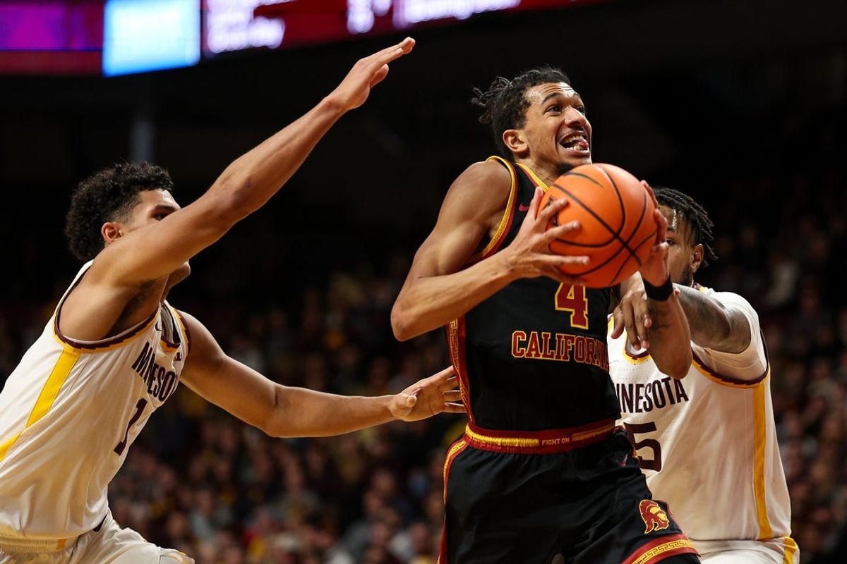 Jan 9, 2026; Minneapolis, Minnesota, USA; Southern California Trojans forward Chad Baker-Mazara (4) drives towards the basket as Minnesota Golden Gophers guard Isaac Asuma (1) defends during the second half at Williams Arena. Mandatory Credit: Matt Krohn-Imagn Images