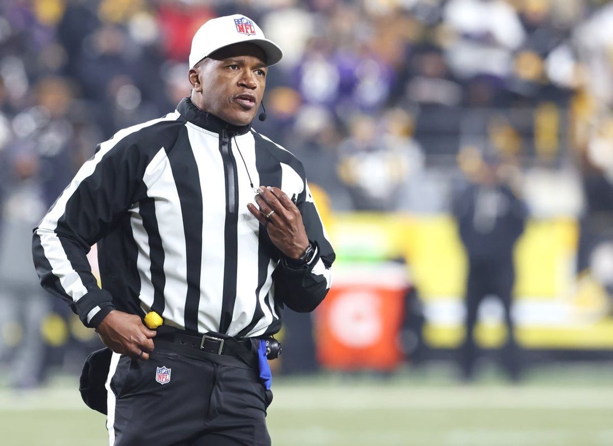 Jan 4, 2026; Pittsburgh, Pennsylvania, USA;  NFL referee Shawn Smith (14) announces a penalty during the second quarter between the Baltimore Ravens and the Pittsburgh Steelers at Acrisure Stadium. Mandatory Credit: Charles LeClaire-Imagn Images