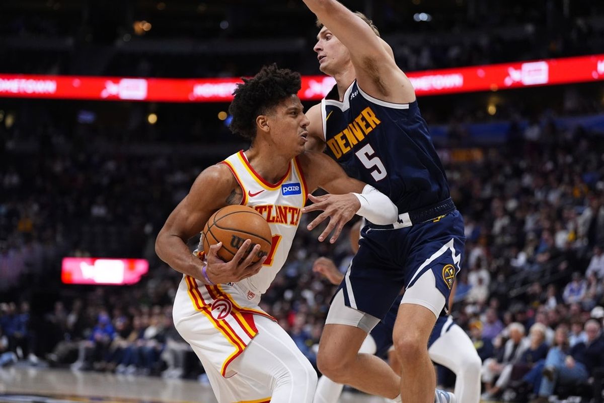 Jan 9, 2026; Denver, Colorado, USA; Atlanta Hawks forward Jalen Johnson (1) drives at Denver Nuggets forward Hunter Tyson (5) in the second half at Ball Arena. Mandatory Credit: Ron Chenoy-Imagn Images
