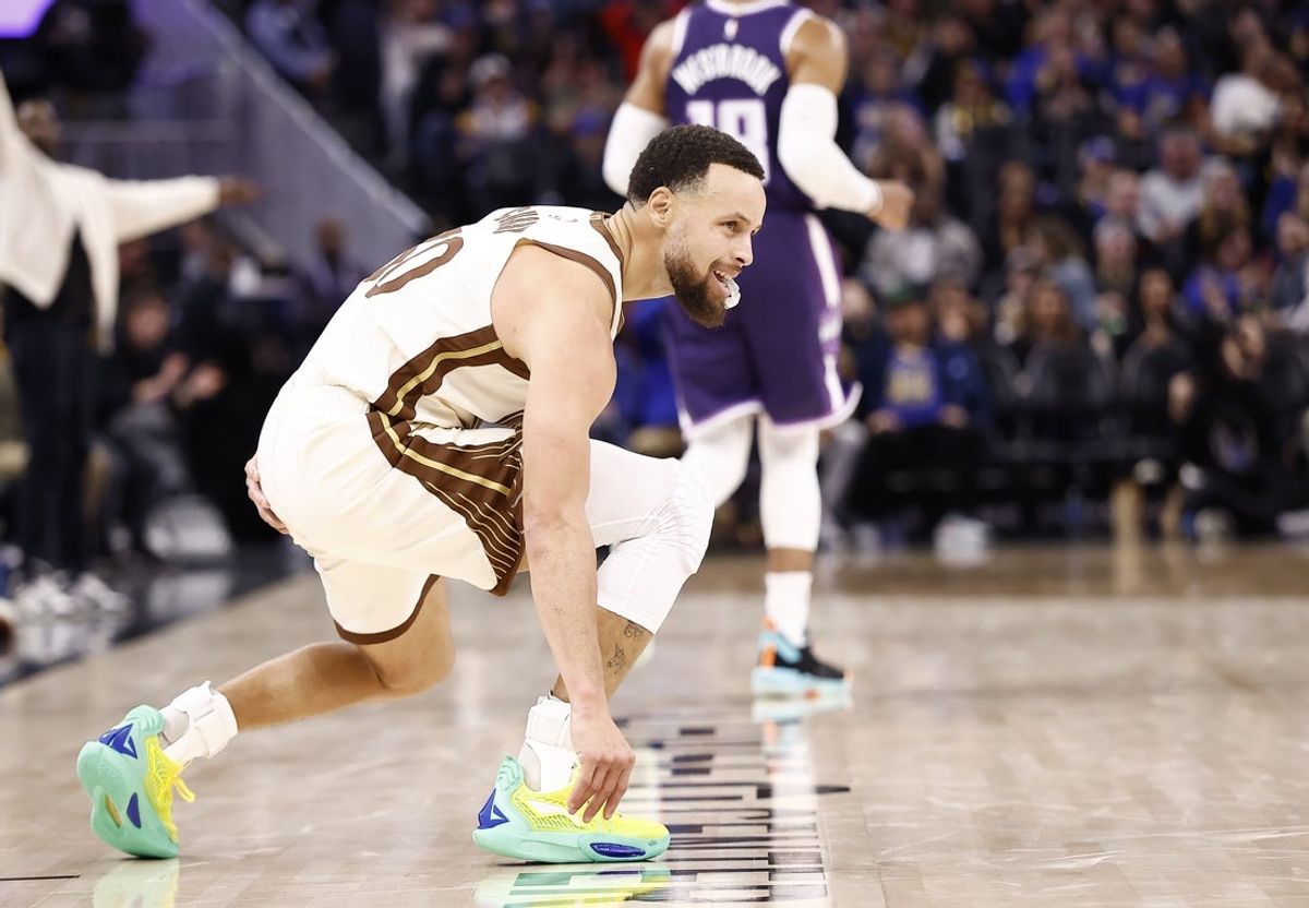 Jan 9, 2026; San Francisco, California, USA; Golden State Warriors guard Stephen Curry (30) smiles after scoring a three point basket agains tSacramento Kings guard Russell Westbrook (18) during the third quarter at Chase Center. Mandatory Credit: Kelley L Cox-Imagn Images