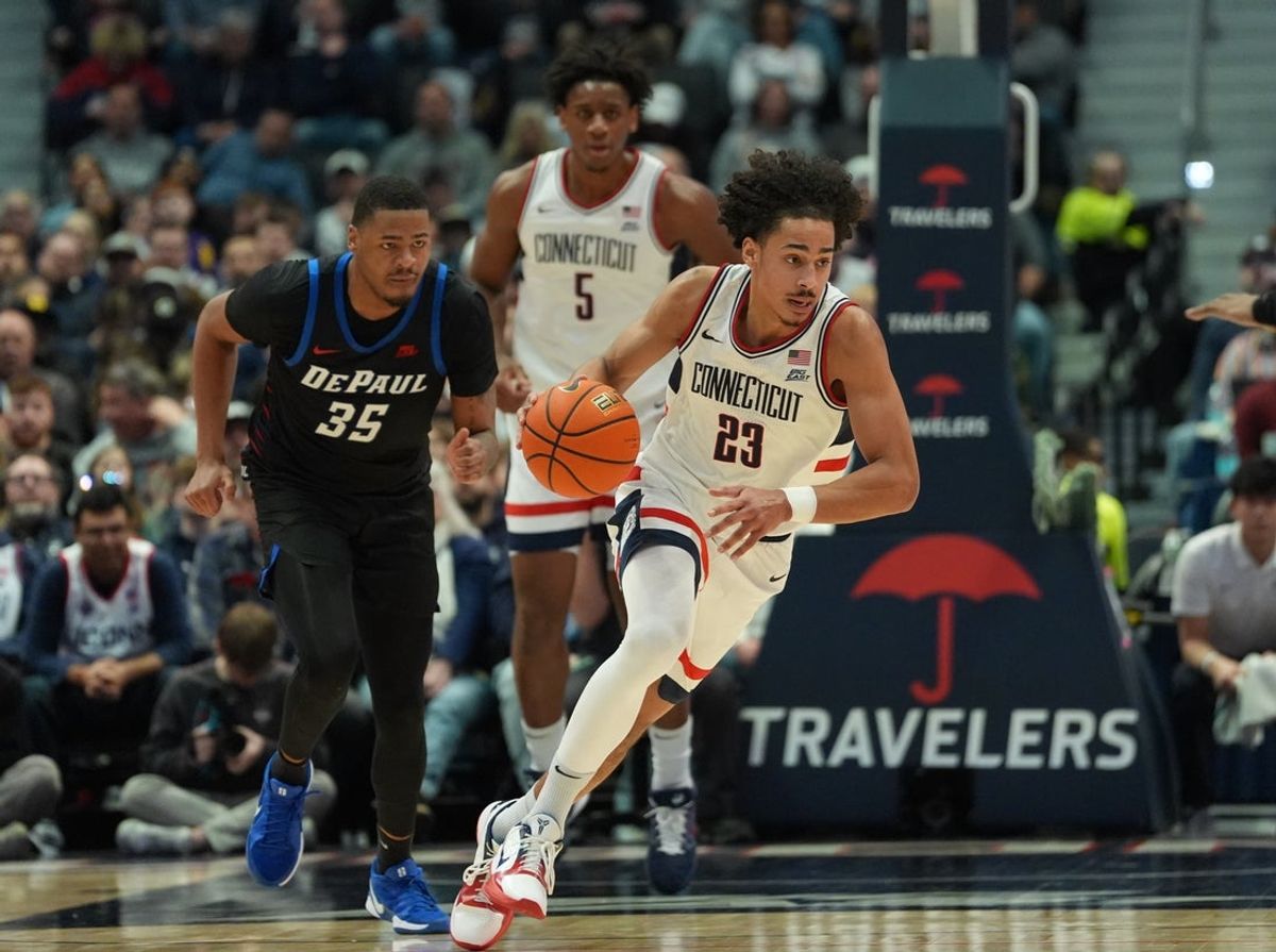 Jan 10, 2026; Hartford, Connecticut, USA; UConn Huskies forward Jayden Ross (23) returns the ball against the DePaul Blue Demons in the first half at PeoplesBank Arena. Mandatory Credit: David Butler II-Imagn Images