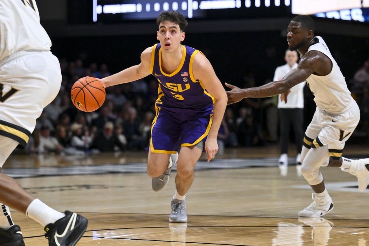 Jan 10, 2026; Nashville, Tennessee, USA; Louisiana State Tigers guard Max MacKinnon (3) drives to the basket against the Vanderbilt Commodores during the first half at Memorial Gymnasium. Mandatory Credit: Steve Roberts-Imagn Images