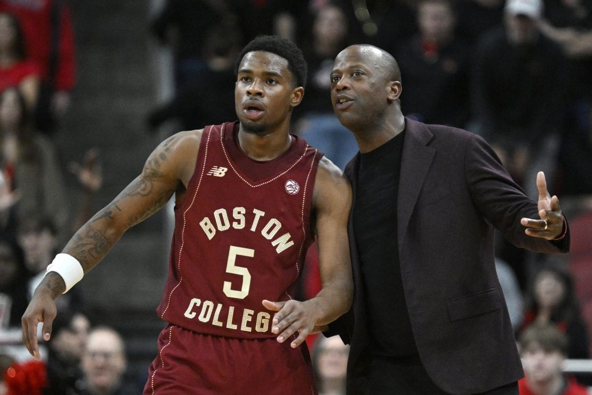 Jan 10, 2026; Louisville, Kentucky, USA;  Boston College Eagles head coach Earl Grant talks with guard Fred Payne (5) during the second half at KFC Yum! Center.  Mandatory Credit: Jamie Rhodes-Imagn Images
