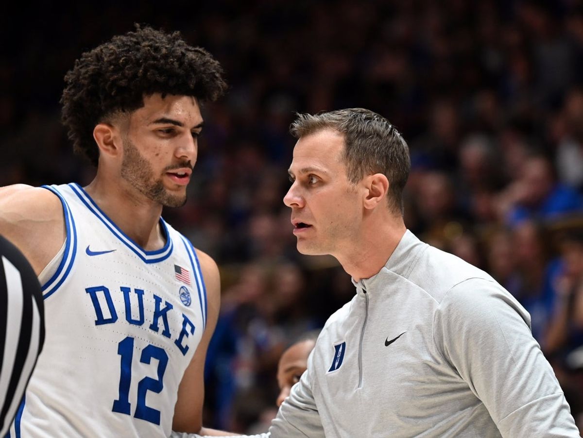 Jan 10, 2026; Durham, North Carolina, USA; Duke Blue Devils forward Cameron Boozer (12) talks to head coach Jon Scheyer during the first half against the Southern Methodist Mustangs at Cameron Indoor Stadium. Mandatory Credit: Rob Kinnan-Imagn Images