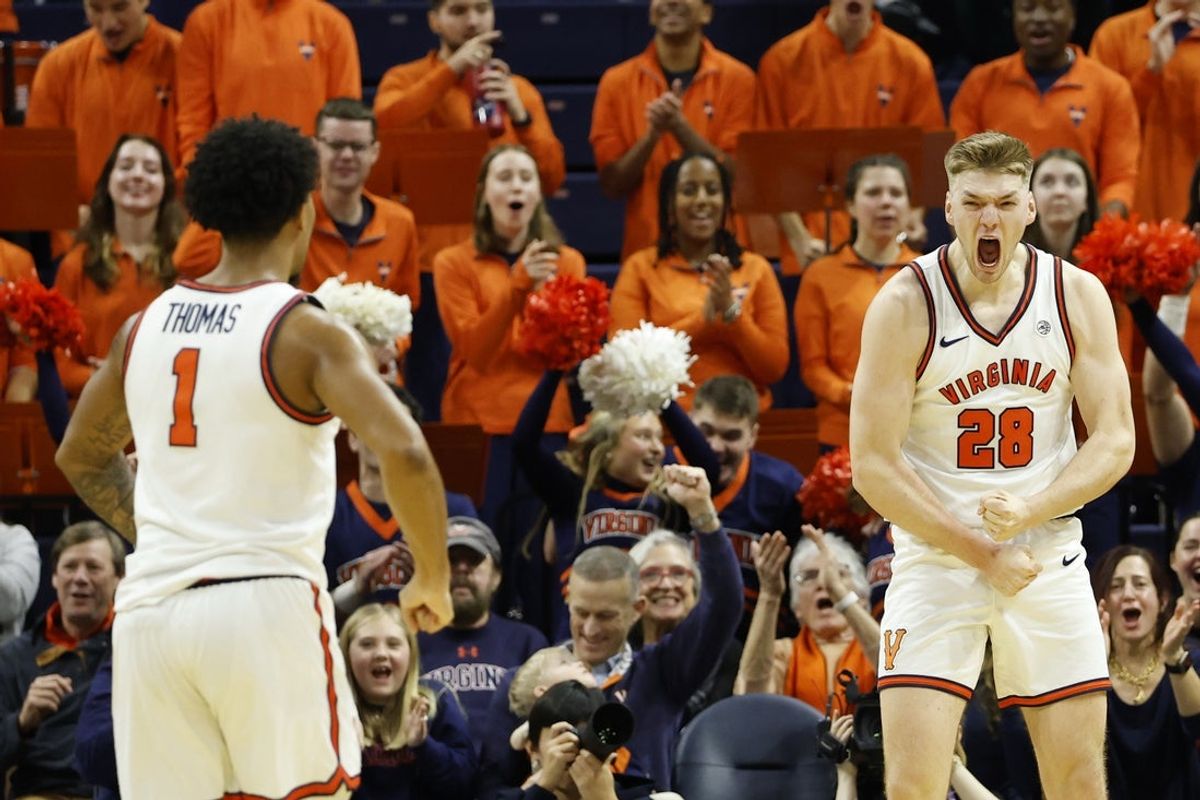 Jan 10, 2026; Charlottesville, Virginia, USA; Virginia Cavaliers forward Thijs de Ridder (28) reacts after scoring while being fouled against the Stanford Cardinal in the first half at John Paul Jones Arena. Mandatory Credit: Geoff Burke-Imagn Images