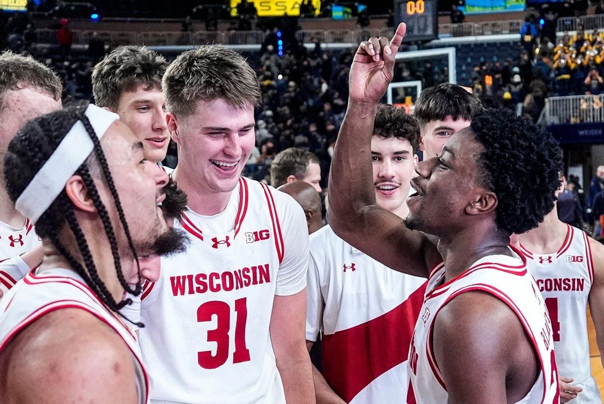 Wisconsin guard John Blackwell (25), center right, celebrates 91-88 win over Michigan at Crisler Center in Ann Arbor on Saturday, Jan. 10, 2026.
