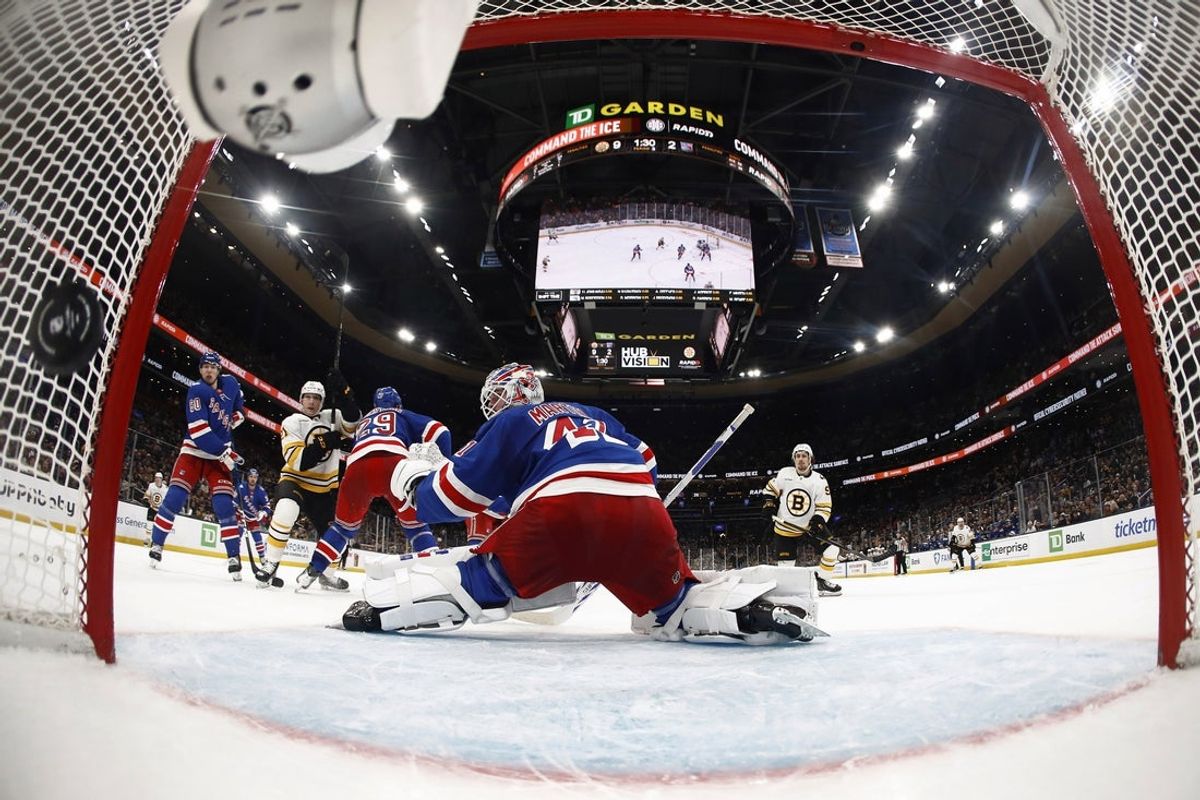 Jan 10, 2026; Boston, Massachusetts, USA; A shot by Boston Bruins center Marat Khusnutdinov (92) (right) goes past New York Rangers goaltender Spencer Martin (41) for his fourth goal of the game during the third period of Boston’s 10-2 win at TD Garden. Mandatory Credit: Winslow Townson-Imagn Images