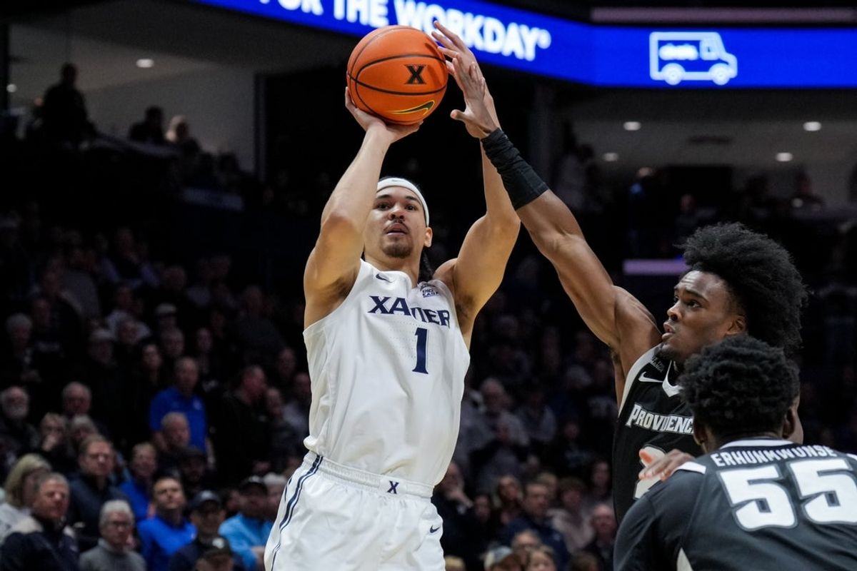 Jan 10, 2026; Cincinnati, Ohio, USA; Xavier Musketeers guard Malik Messina-Moore (1) shoots against Providence Friars guard Jaylin Sellers (2) in the first half at the Cintas Center. Mandatory Credit: Aaron Doster-Imagn Images