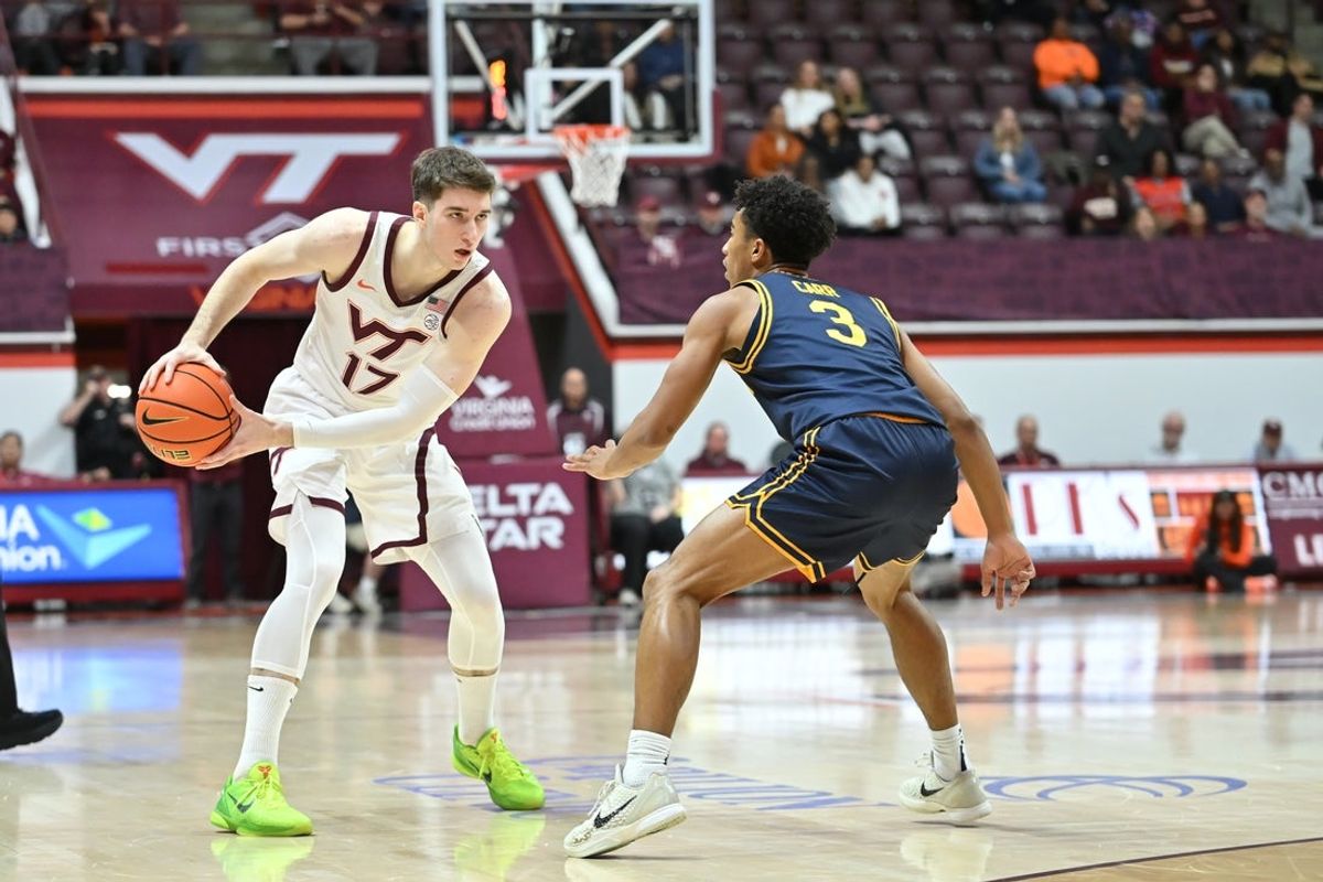 Jan 10, 2026; Blacksburg, Virginia, USA; Virginia Tech Hokies guard Neoklis Avdalas (17) looks to pass the ball as California Golden Bears guard Semetri (tt) Carr (3) defends  during the first half at Cassell Coliseum. Mandatory Credit: Brian Bishop-Imagn Images