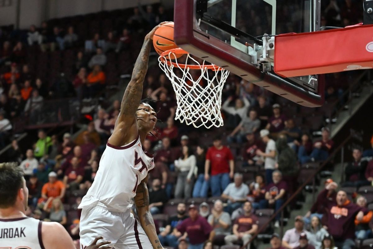 Jan 10, 2026; Blacksburg, Virginia, USA;  Virginia Tech Hokies forward Tobi Lawal (1) dunks the ball during the first half at Cassell Coliseum. Mandatory Credit: Brian Bishop-Imagn Images