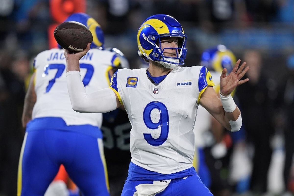 Jan 10, 2026; Charlotte, NC, USA; Los Angeles Rams quarterback Matthew Stafford (9) drops back to pass against the Carolina Panthers in the first half during the NFC Wild Card Round game at Bank of America Stadium. Mandatory Credit: Jim Dedmon-Imagn Images