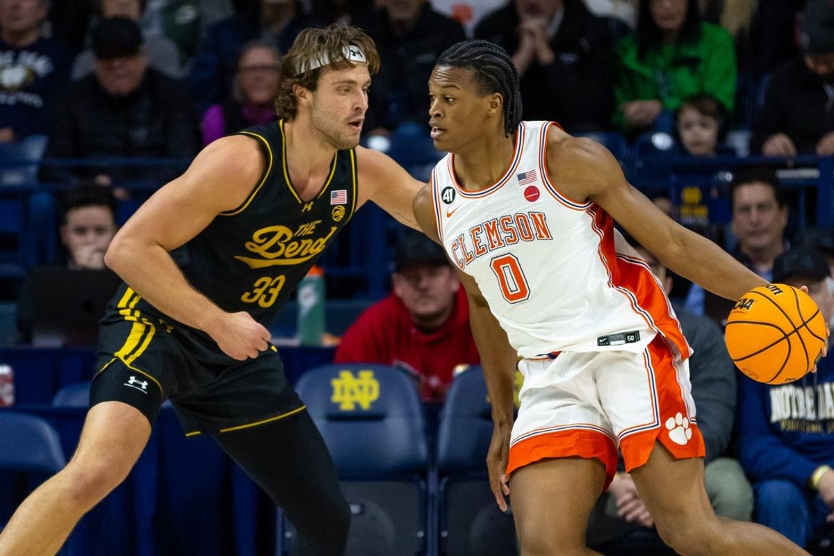 Jan 10, 2026; South Bend, Indiana, USA; Clemson Tigers forward RJ Godfrey (0) works against Notre Dame Fighting Irish forward Carson Towt (33) during the first half at Purcell Pavilion at the Joyce Center. Mandatory Credit: Michael Caterina-Imagn Images