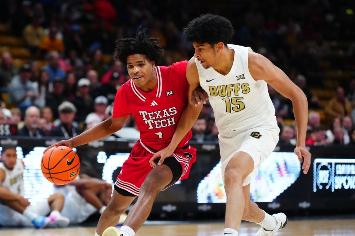 Jan 10, 2026; Boulder, Colorado, USA; Colorado Buffaloes guard Felix Kossaras (15) defends on Texas Tech Red Raiders guard Christian Anderson (4) in the first half at the CU Events Center. Mandatory Credit: Ron Chenoy-Imagn Images