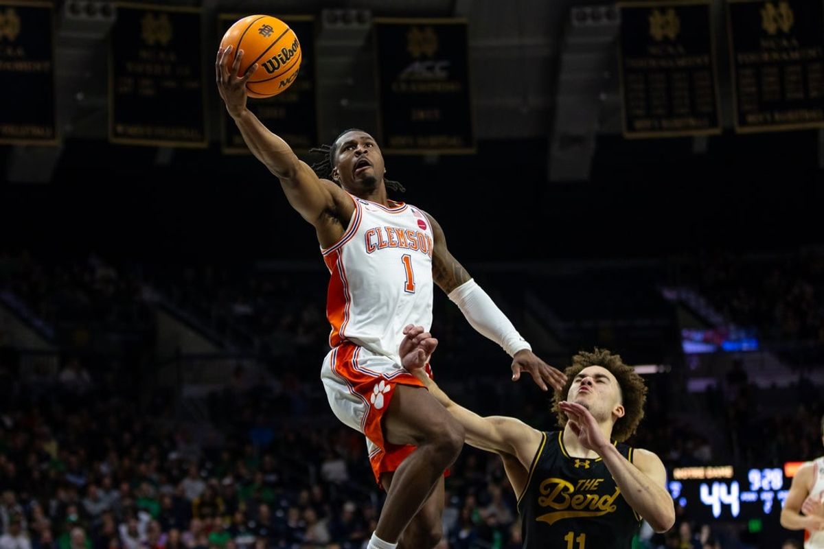 Jan 10, 2026; South Bend, Indiana, USA; Clemson Tigers guard Jestin Porter (1) drives past Notre Dame Fighting Irish guard Braeden Shrewsberry (11) during the second half at Purcell Pavilion at the Joyce Center. Mandatory Credit: Michael Caterina-Imagn Images