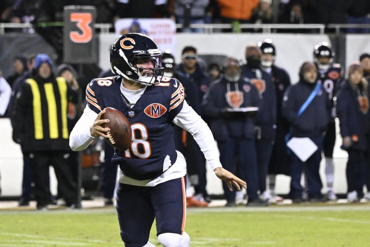 Jan 10, 2026; Chicago, IL, USA;  Chicago Bears quarterback Caleb Williams (18) looks downfield against the Green Bay Packers during the first half of an NFC Wild Card Round game at Soldier Field. Mandatory Credit: Matt Marton-Imagn Images