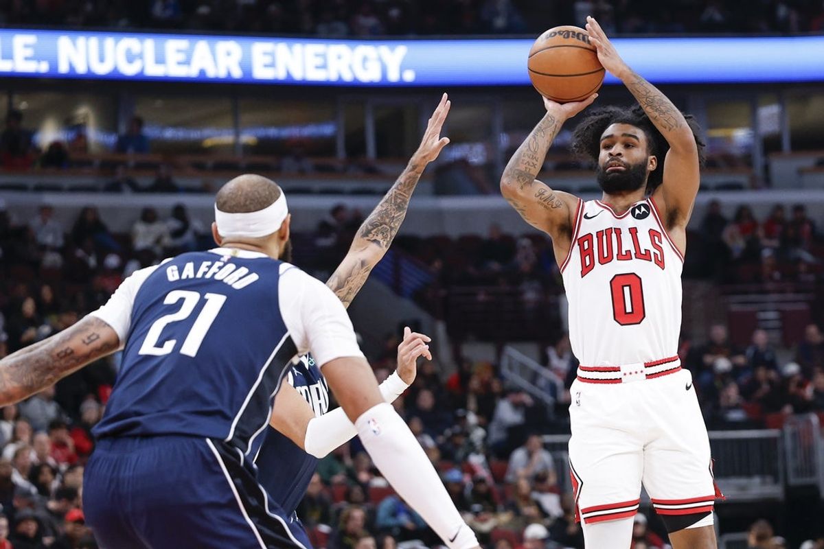 Jan 10, 2026; Chicago, Illinois, USA; Chicago Bulls guard Coby White (0) shoots against the Dallas Mavericks during the first half at United Center. Mandatory Credit: Kamil Krzaczynski-Imagn Images