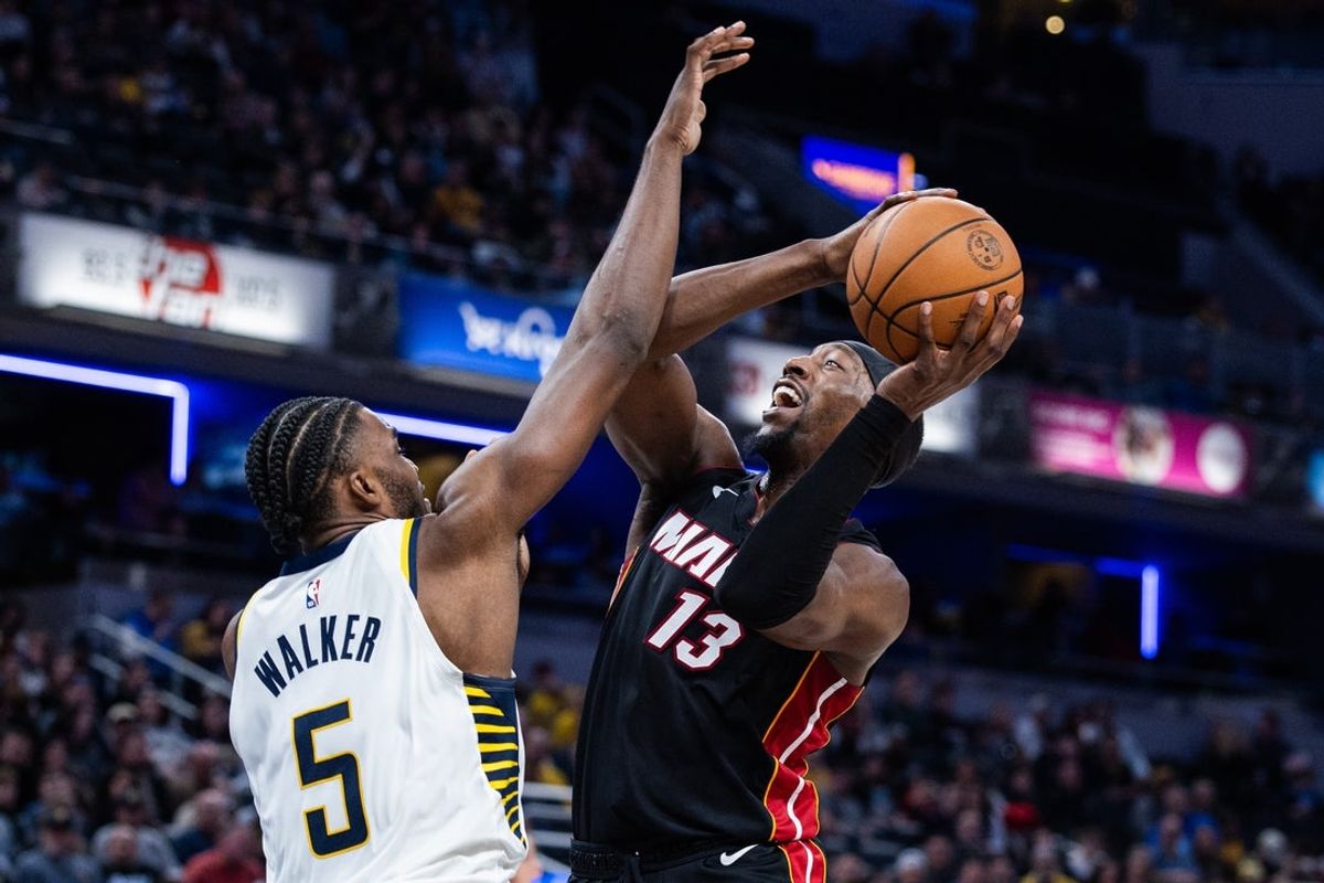 Jan 10, 2026; Indianapolis, Indiana, USA; Miami Heat center Bam Adebayo (13) shoots the ball while Indiana Pacers forward Jarace Walker (5) defends in the second half at Gainbridge Fieldhouse. Mandatory Credit: Trevor Ruszkowski-Imagn Images