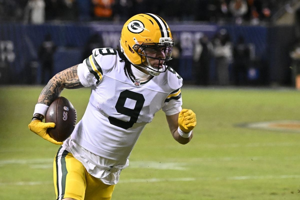 Jan 10, 2026; Chicago, IL, USA;  Green Bay Packers wide receiver Christian Watson (9) runs after the catch against the Chicago Bears during the first half of an NFC Wild Card Round game at Soldier Field. Mandatory Credit: Matt Marton-Imagn Images