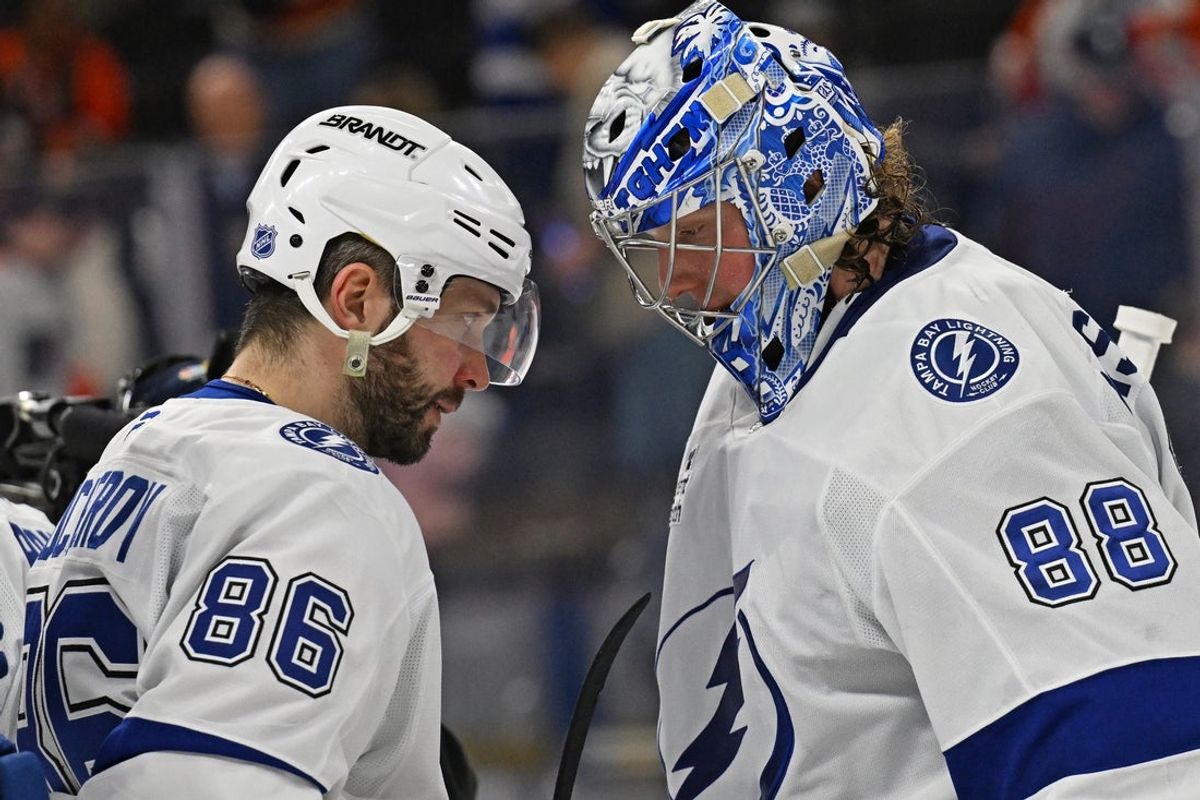Jan 10, 2026; Philadelphia, Pennsylvania, USA; Tampa Bay Lightning right wing Nikita Kucherov (86) and goaltender Andrei Vasilevskiy (88) celebrate win  against the Philadelphia Flyers during the third period at Xfinity Mobile Arena. Mandatory Credit: Eric Hartline-Imagn Images