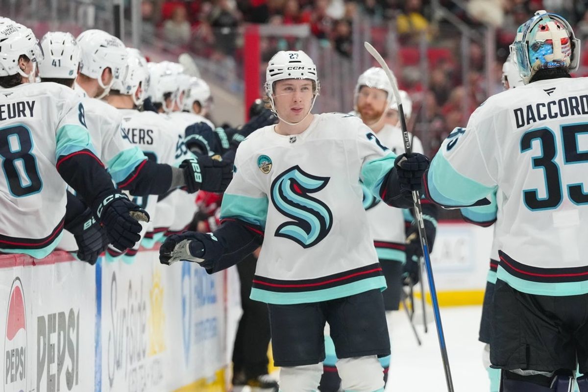 Jan 10, 2026; Raleigh, North Carolina, USA;  Seattle Kraken center Berkly Catton (27) celebrates his goal against the Carolina Hurricanes during the third period at Lenovo Center. Mandatory Credit: James Guillory-Imagn Images
