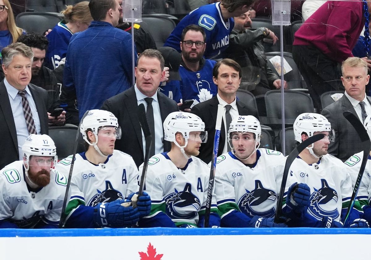 Jan 10, 2026; Toronto, Ontario, CAN; Vancouver Canucks head coach Adam Foote watches the action against the Toronto Maple Leafs during the third period at Scotiabank Arena. Mandatory Credit: Nick Turchiaro-Imagn Images