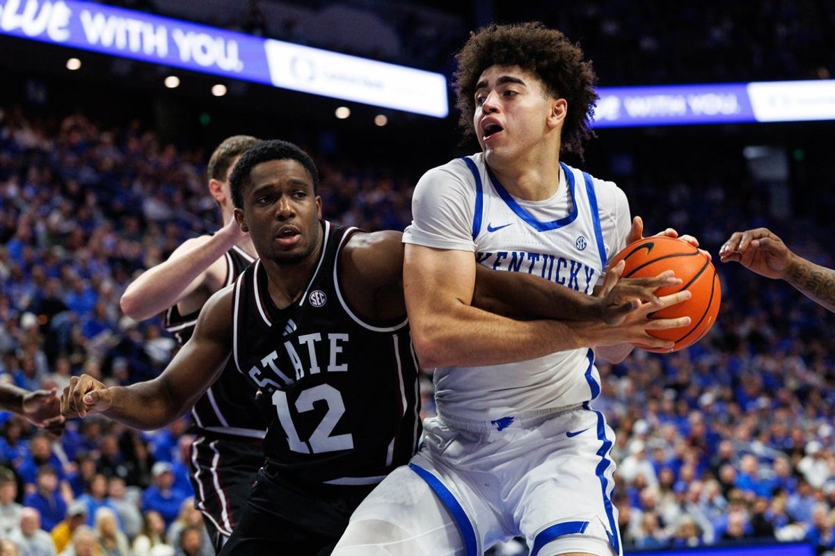 Jan 10, 2026; Lexington, Kentucky, USA; Kentucky Wildcats center Malachi Moreno (24) drives to the basket against Mississippi State Bulldogs guard Josh Hubbard (12) during the second half at Rupp Arena at Central Bank Center. Mandatory Credit: Jordan Prather-Imagn Images